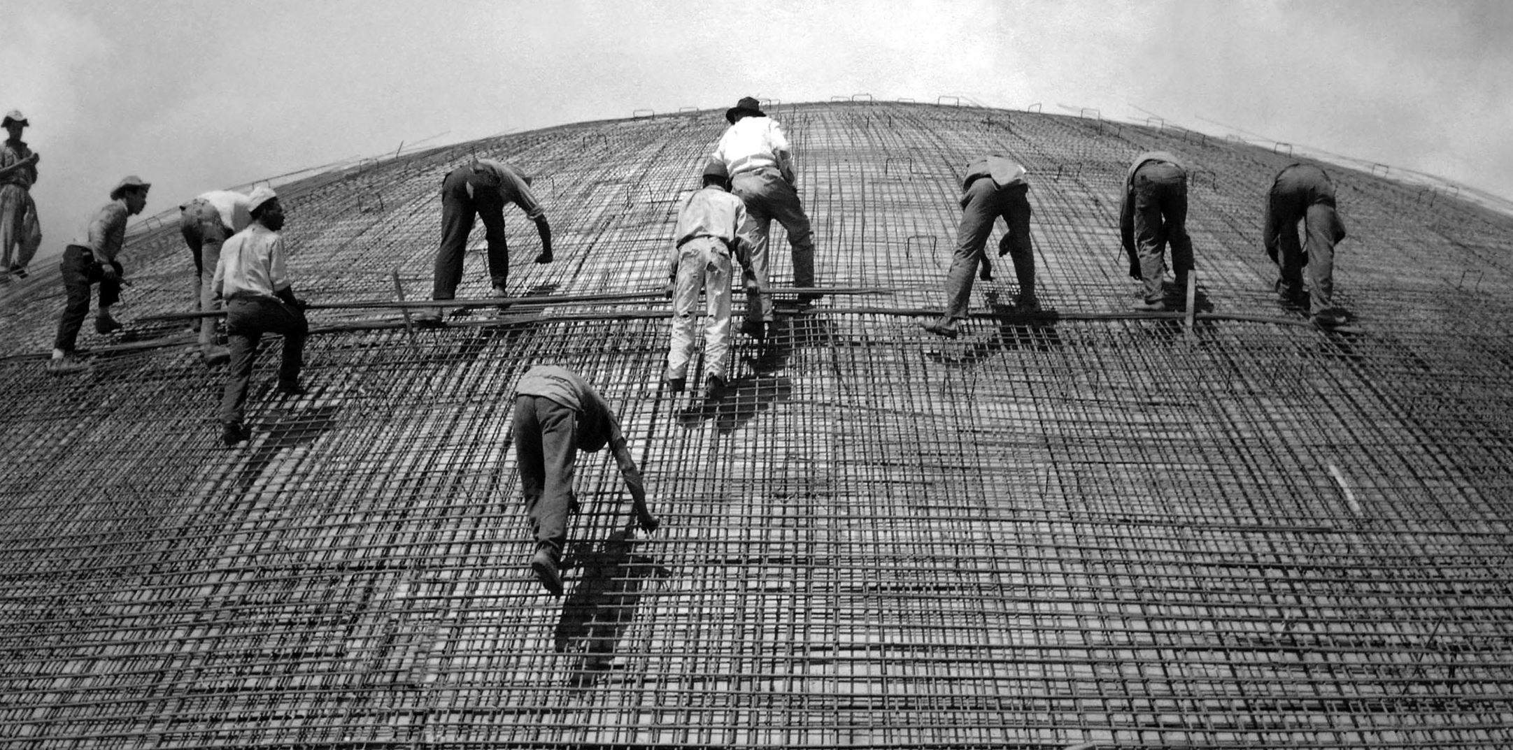 Image of workers laying rebar for a concrete slab